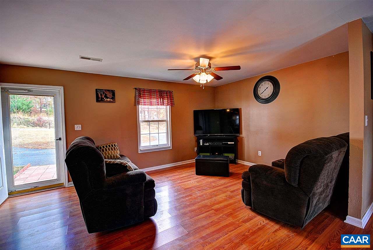 716 Jonquil Road Ruckersville, VA 22968 - Photo 10 of 21 a living room with furniture and a window