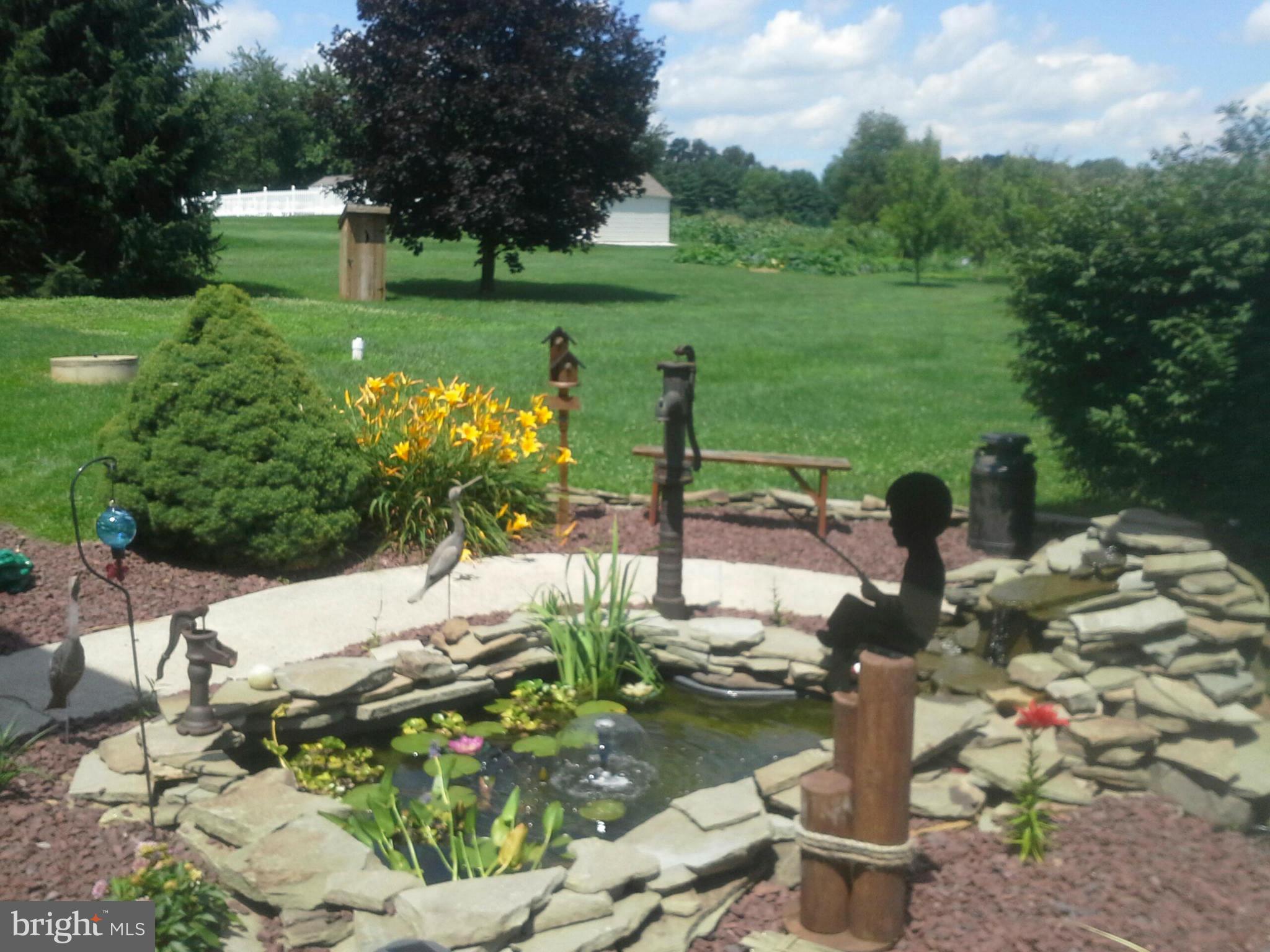 260 Connelly Road Rising Sun, MD 21911 - Photo 5 of 6 a view of a garden with an outdoor seating