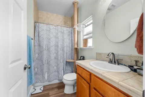 a view of entryway with furniture and wooden floor