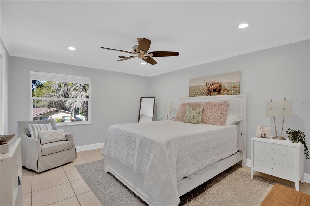 557 Karen Avenue Altamonte Springs, FL 32701 - Photo 16 of 35 a bedroom with a bed and a couch