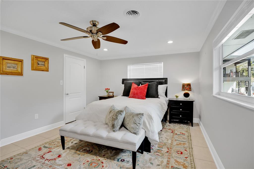 557 Karen Avenue Altamonte Springs, FL 32701 - Photo 18 of 35 a bedroom with a bed and wooden floor