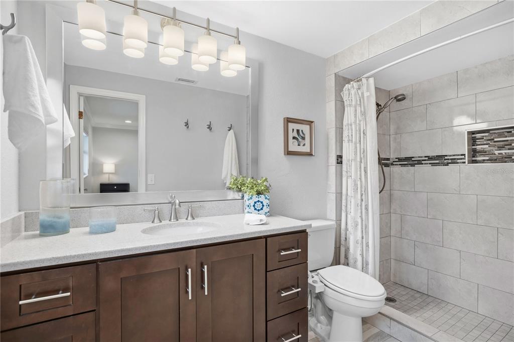 557 Karen Avenue Altamonte Springs, FL 32701 - Photo 20 of 35 a bathroom with a sink toilet a mirror and shower