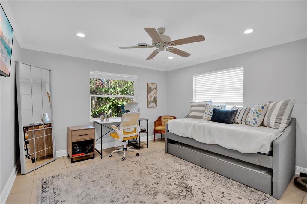 557 Karen Avenue Altamonte Springs, FL 32701 - Photo 21 of 35 a living room with furniture a fireplace and a window