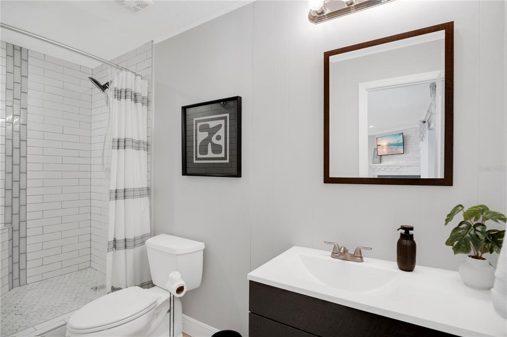 557 Karen Avenue Altamonte Springs, FL 32701 - Photo 22 of 35 a bathroom with a sink mirror and a toilet