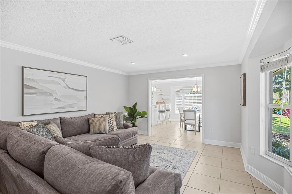 557 Karen Avenue Altamonte Springs, FL 32701 - Photo 5 of 35 a living room with furniture and a large window