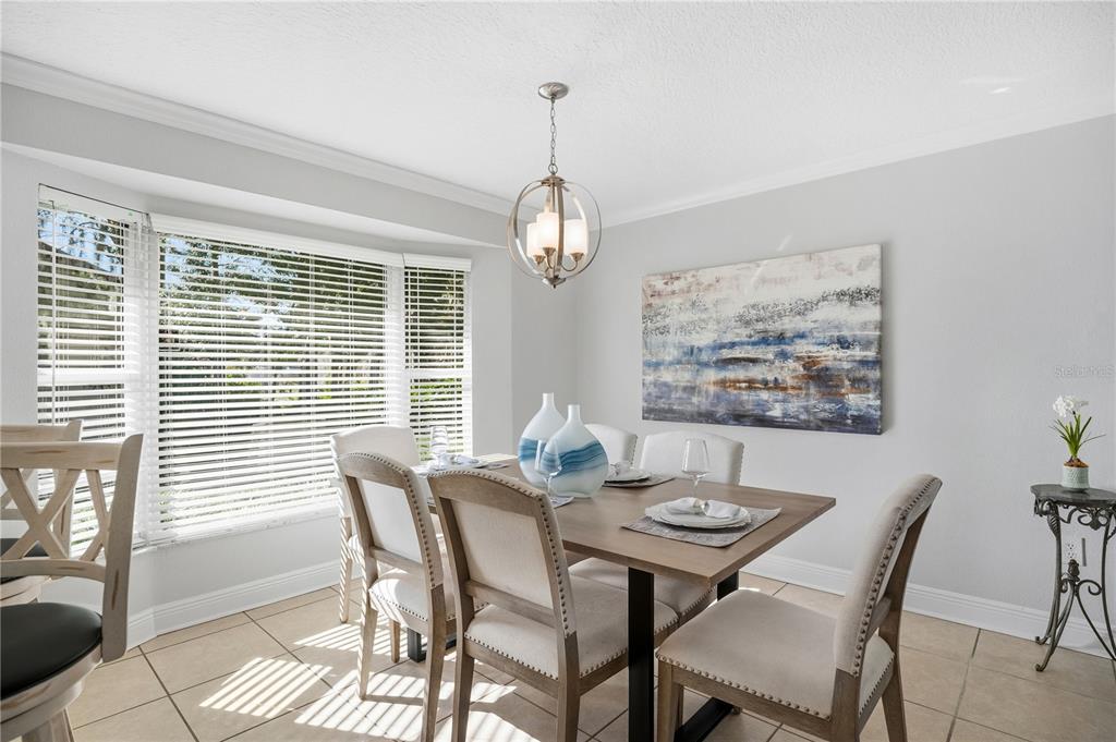 557 Karen Avenue Altamonte Springs, FL 32701 - Photo 9 of 35 a dining room with furniture and window