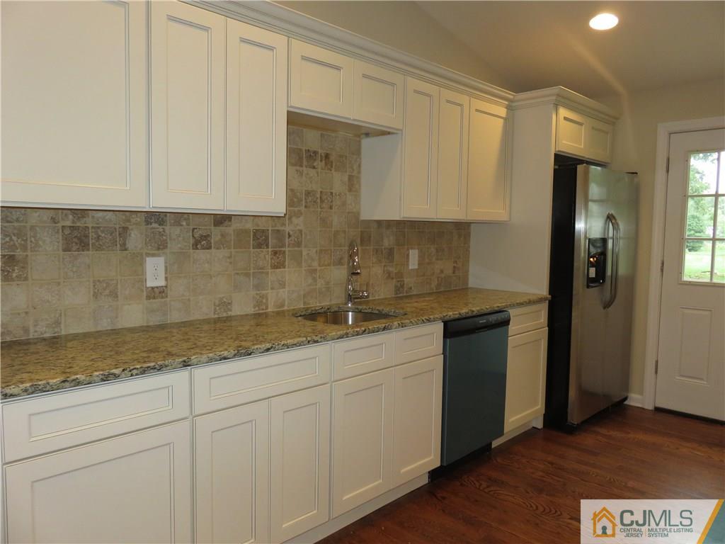 58 Harmon Road Edison, NJ 08837 - Photo 6 of 20 a kitchen with a sink and cabinets
