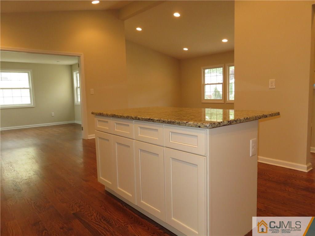 58 Harmon Road Edison, NJ 08837 - Photo 7 of 20 a view of a kitchen cabinets and wooden floor
