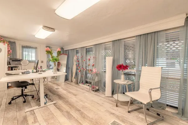 a view of a livingroom with furniture and a window