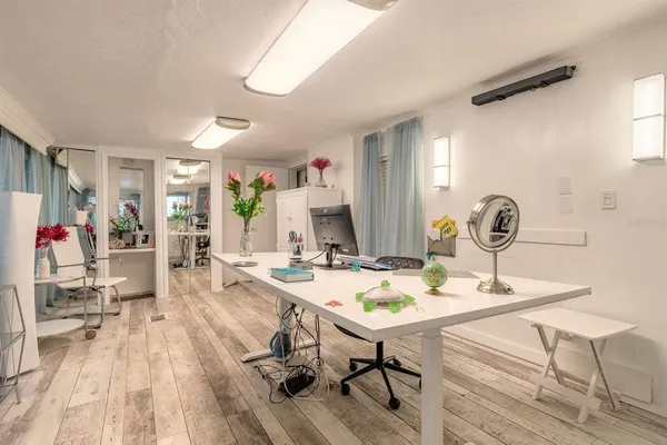 a view of a dining room with furniture and wooden floor