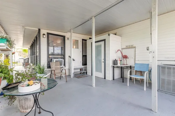 a view of a livingroom with furniture and windows