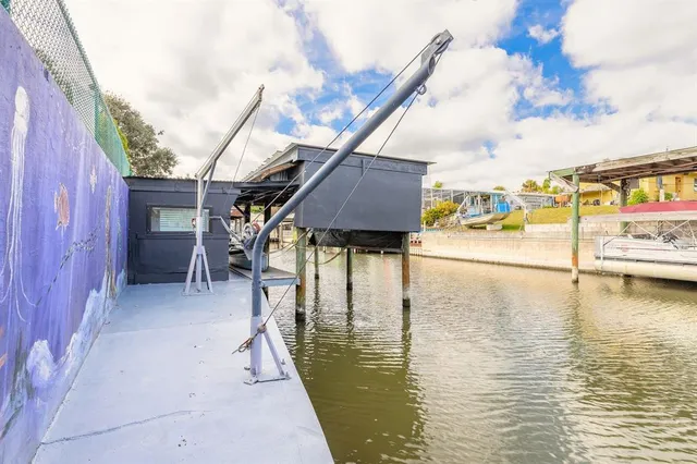 a view of a street with potted plants