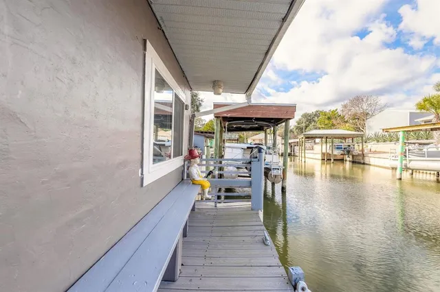 a spacious bathroom with a sink a mirror and next to a window
