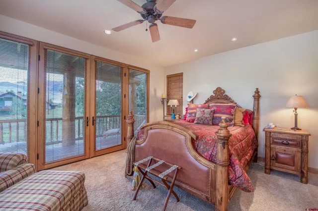 a bed room with a bed and a chandelier