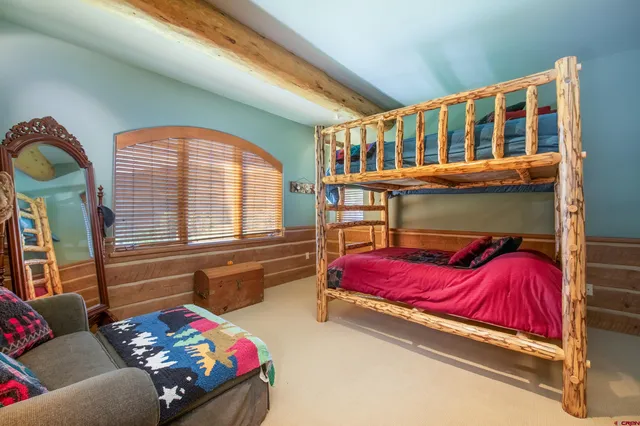 a kids bedroom with a bed and a window