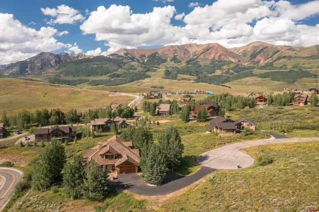 a view of a city with mountains in the background