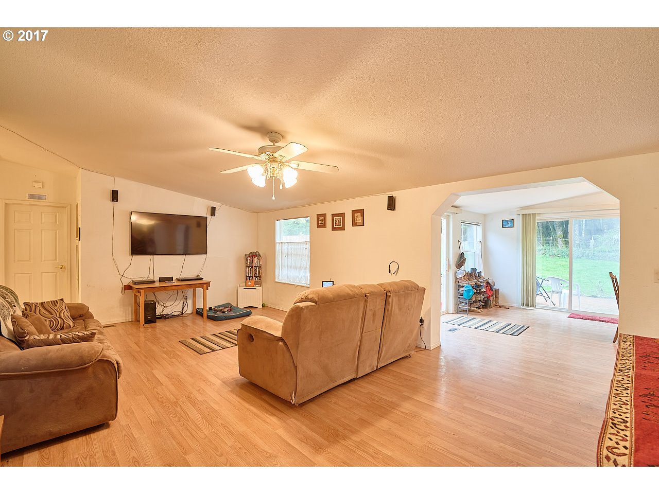 47765 Southwest Hebo Road Grand Ronde, OR 97347 - Photo 7 of 31 a living room with furniture and a flat screen tv
