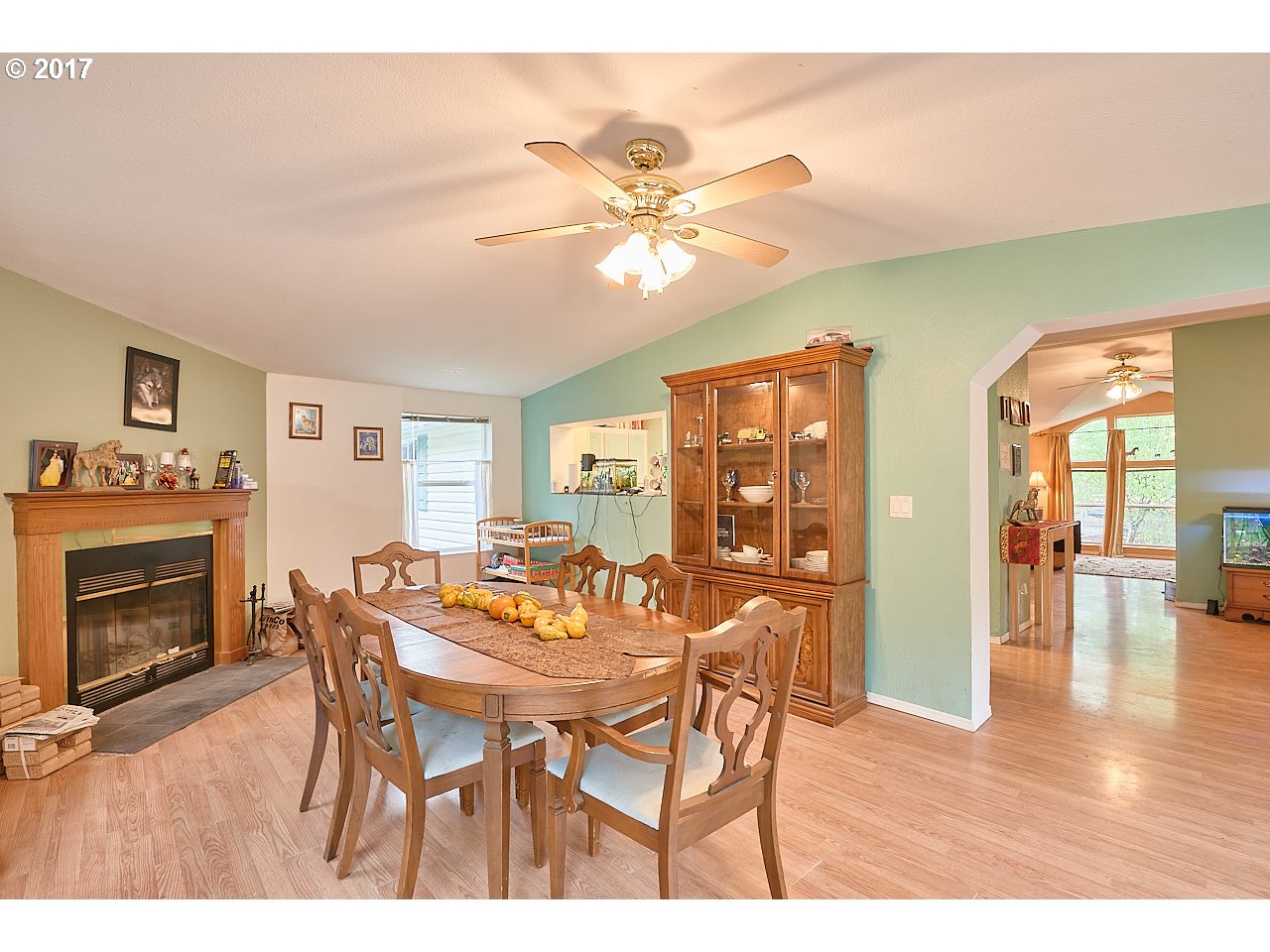47765 Southwest Hebo Road Grand Ronde, OR 97347 - Photo 8 of 31 a dining room with furniture a fireplace and wooden floor