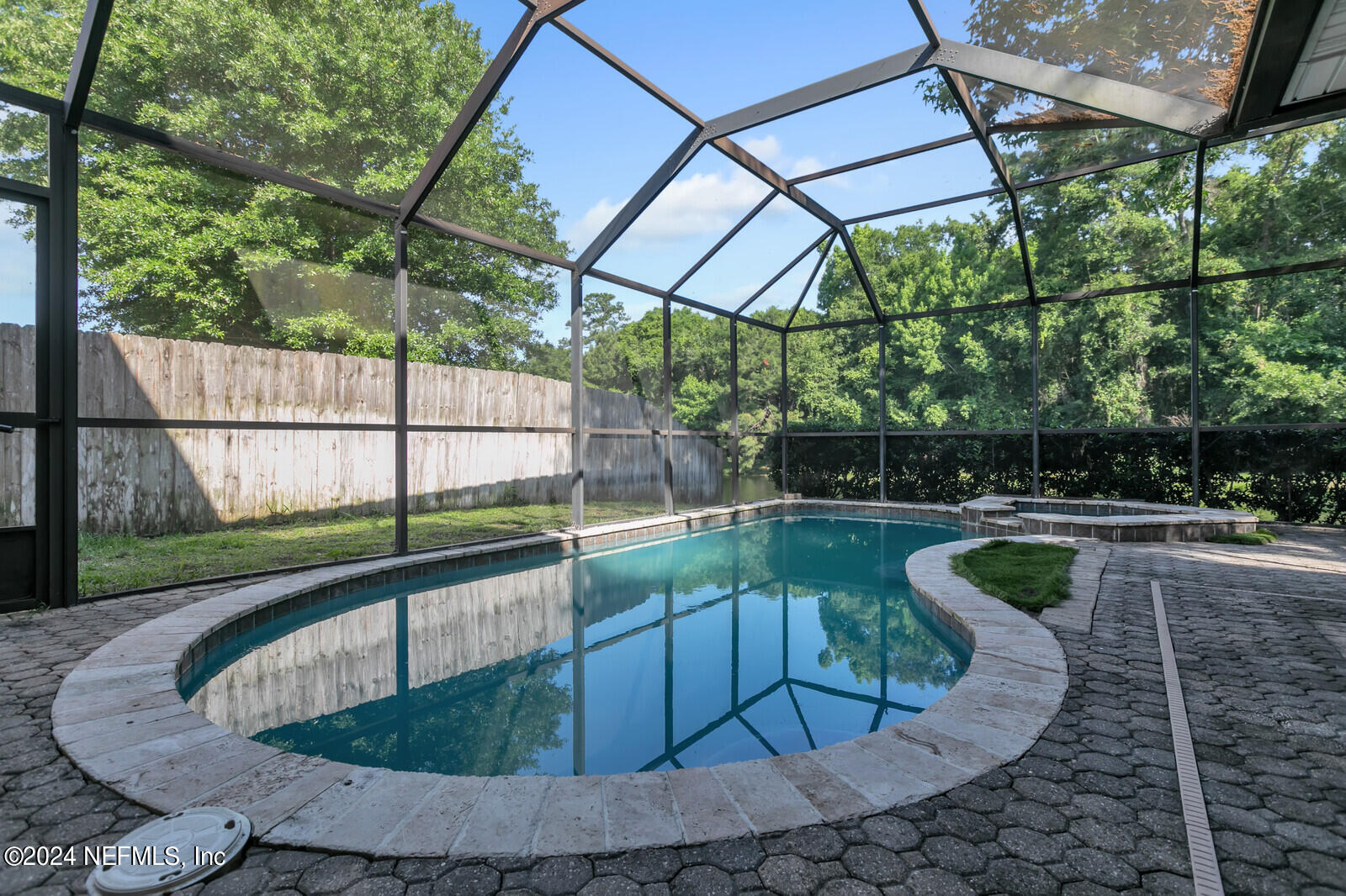 a view of swimming pool with a patio