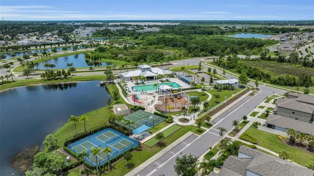 an aerial view of a house with outdoor space