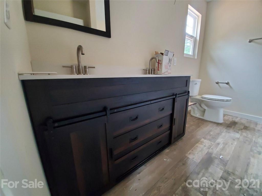 446 Porter Road Rock Hill, SC 29730 - Photo 13 of 15 a bathroom with a toilet sink and mirror