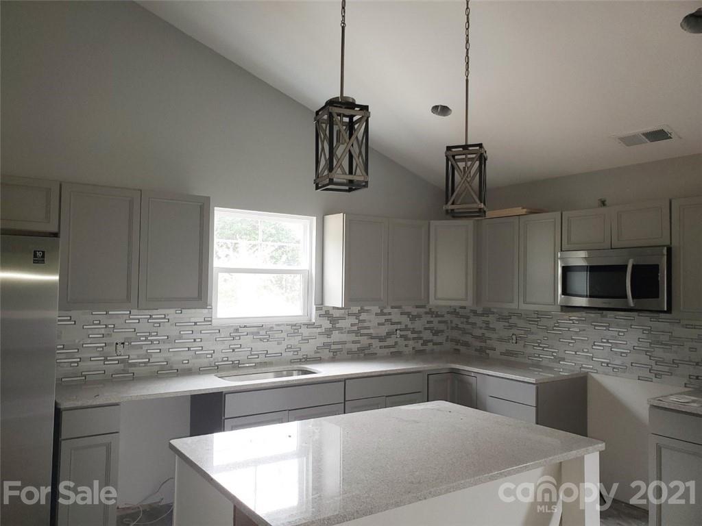 446 Porter Road Rock Hill, SC 29730 - Photo 3 of 15 a kitchen with a sink and a microwave