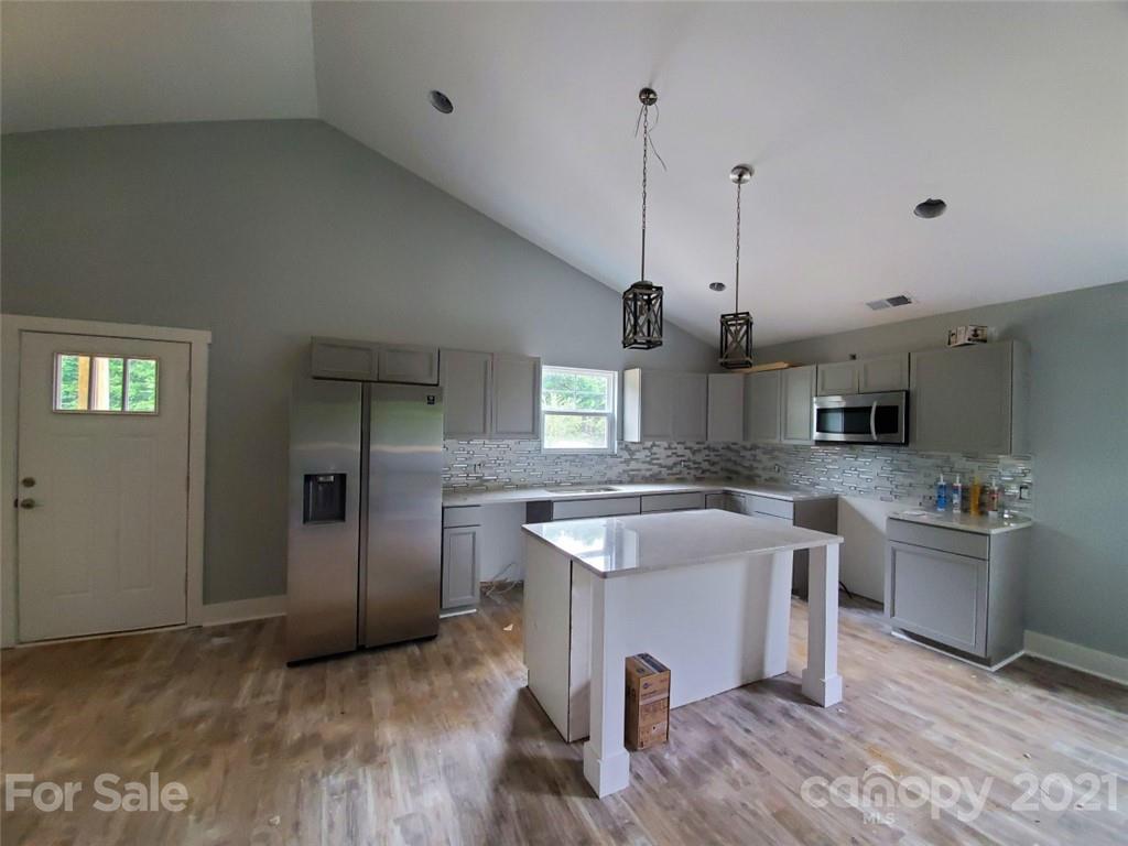446 Porter Road Rock Hill, SC 29730 - Photo 4 of 15 a kitchen with stainless steel appliances granite countertop a sink and stove