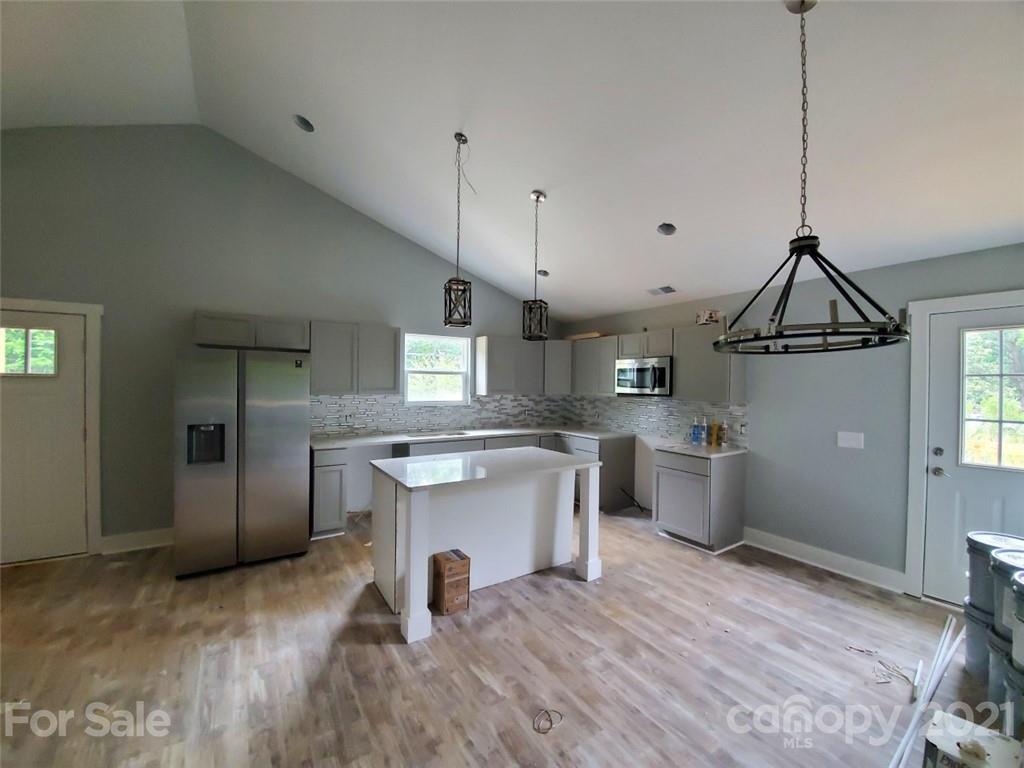 446 Porter Road Rock Hill, SC 29730 - Photo 5 of 15 a open kitchen with a sink stove and refrigerator
