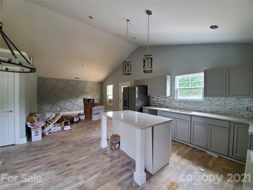446 Porter Road Rock Hill, SC 29730 - Photo 6 of 15 a large kitchen with kitchen island a sink stainless steel appliances and cabinets