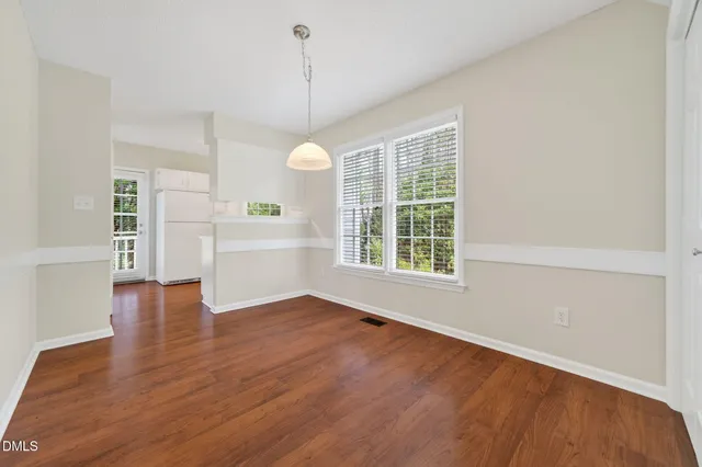 a bathroom with a toilet a sink a mirror and a bathtub