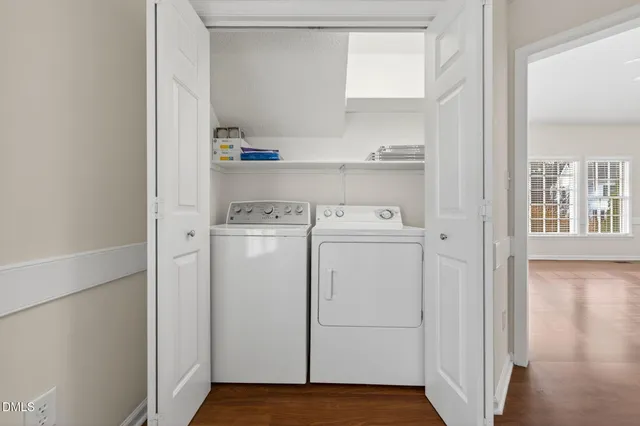 a bathroom with a sink a toilet and a window