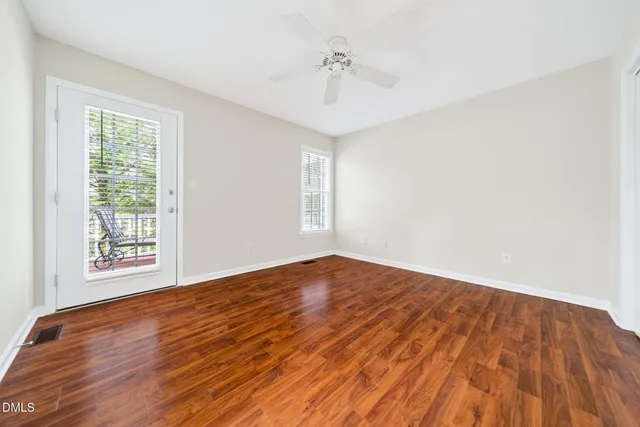 a view of bedroom with wooden floor