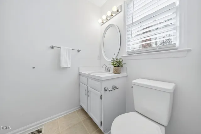 a view of a roof deck with table and chairs and wooden floor