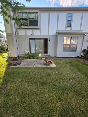 a view of a backyard of the house