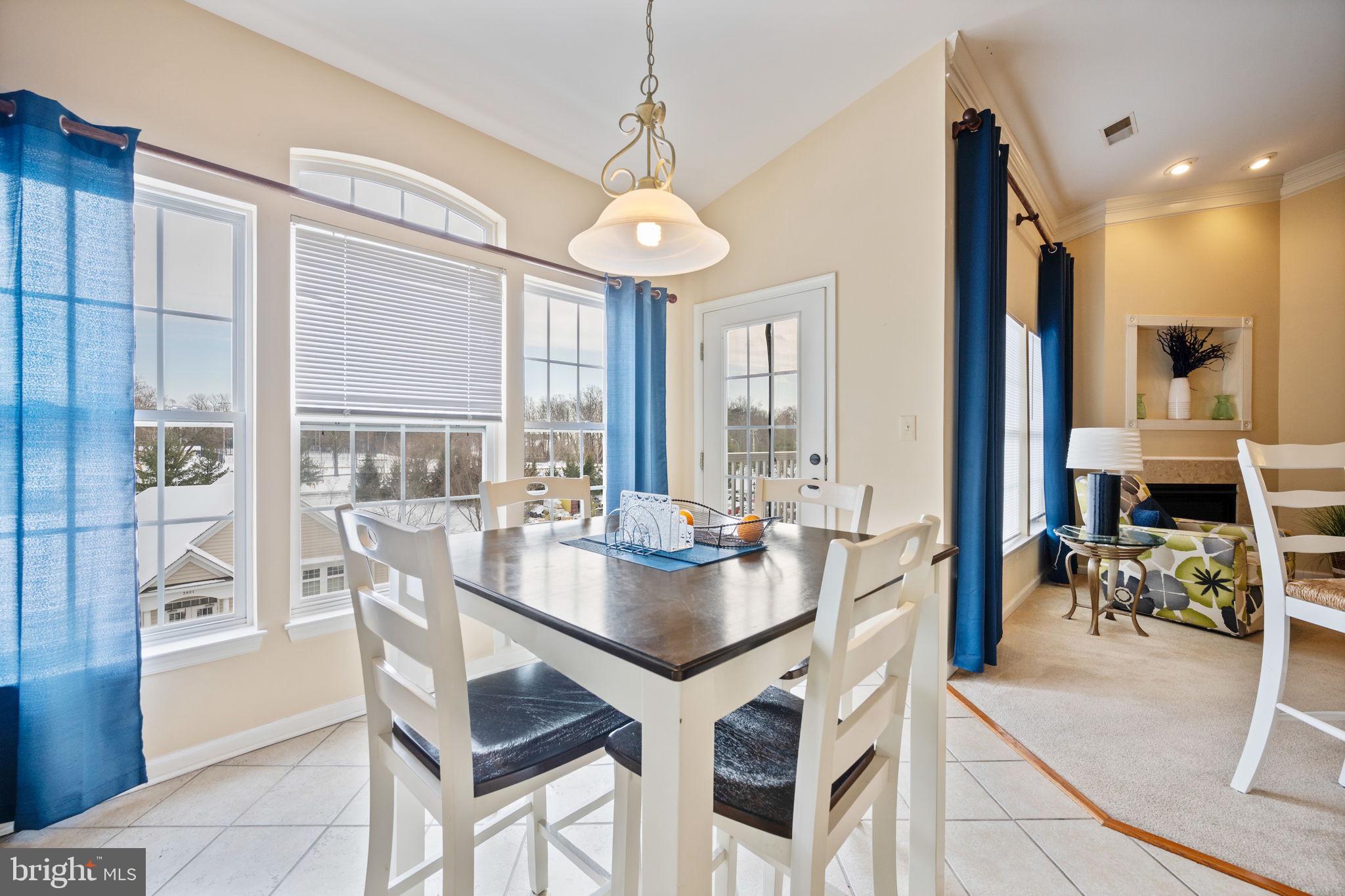 2602 Clarion Court, Unit 404 Odenton, MD 21113 - Photo 20 of 38 a view of a dining room with furniture window and outside view