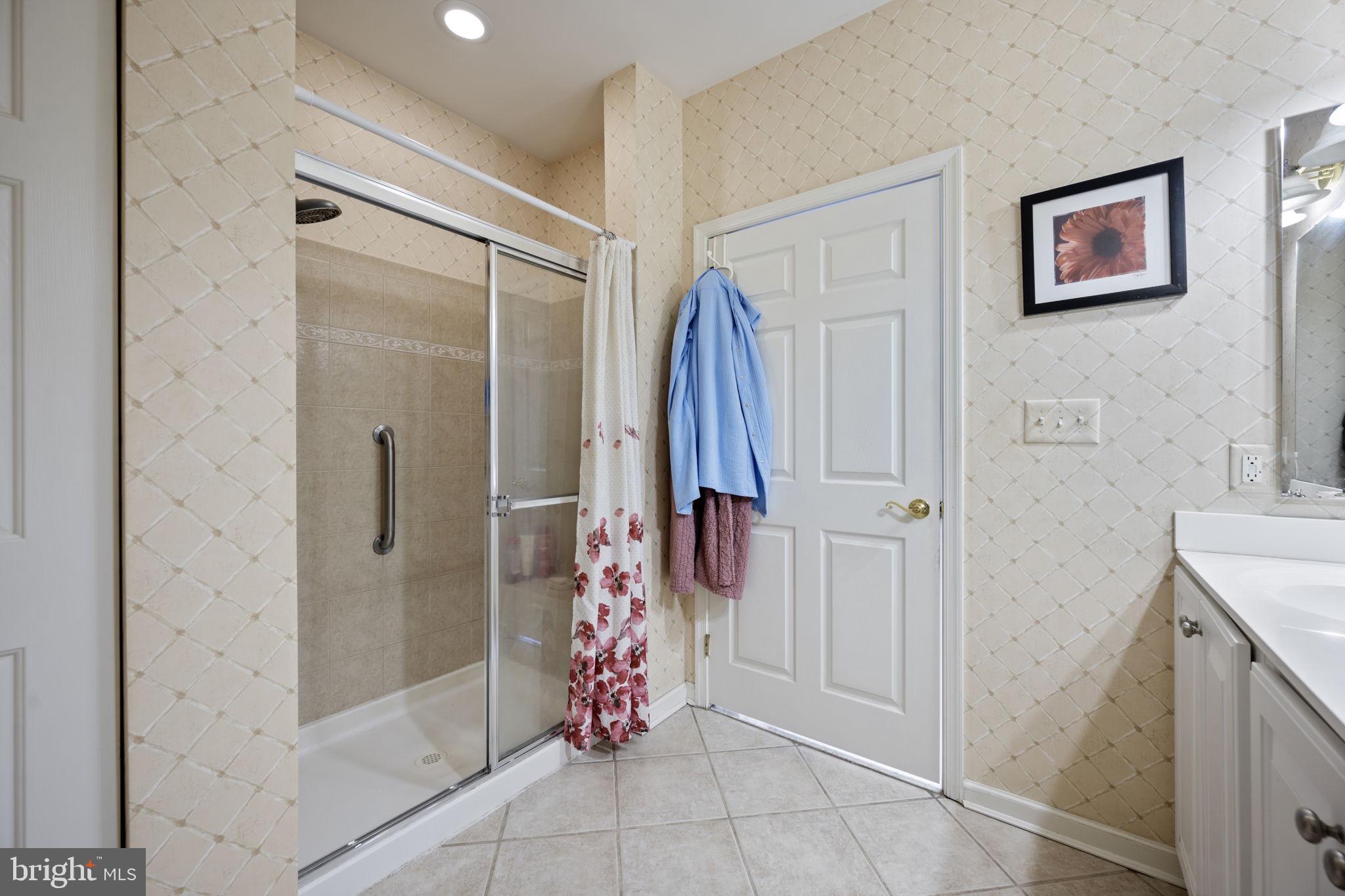 2602 Clarion Court, Unit 404 Odenton, MD 21113 - Photo 26 of 38 a bathroom with a shower and a sink