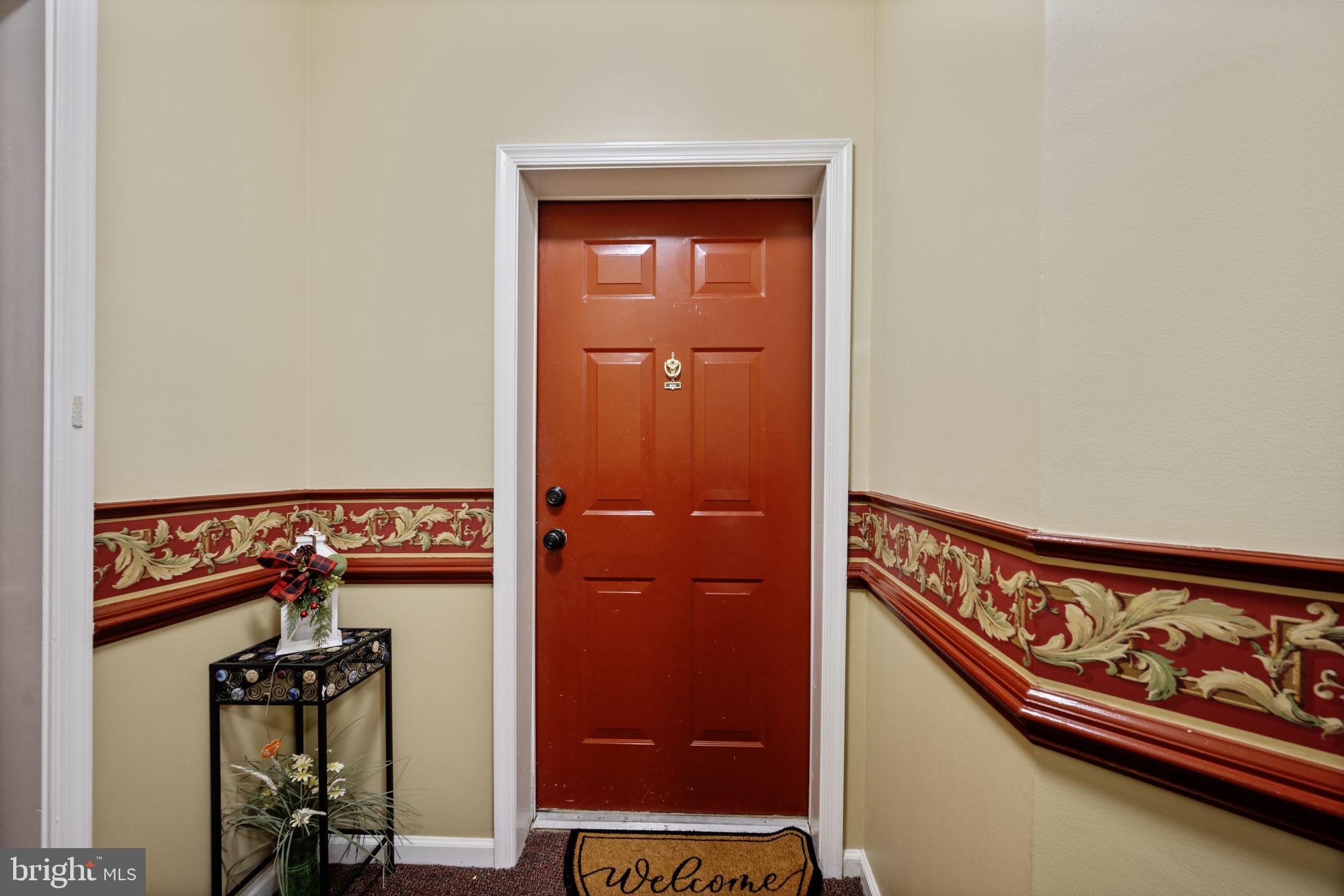 2602 Clarion Court, Unit 404 Odenton, MD 21113 - Photo 3 of 38 a view of a hallway with storage