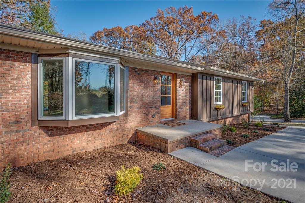 438 Gilbert Road Columbus, NC 28722 - Photo 2 of 46 a view of a house with backyard and sitting area