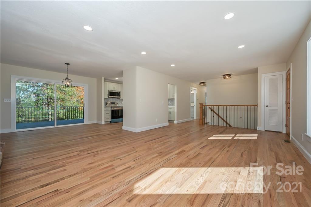 438 Gilbert Road Columbus, NC 28722 - Photo 11 of 46 a view of a room with wooden floor and a window