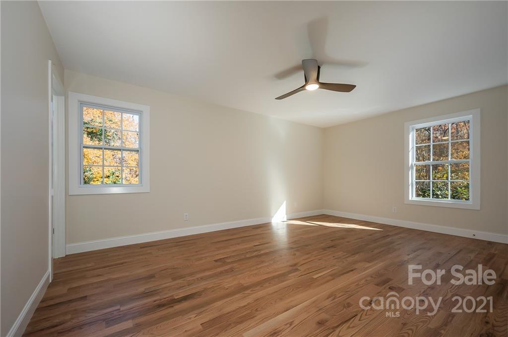 438 Gilbert Road Columbus, NC 28722 - Photo 19 of 46 wooden floor in an empty room with a window
