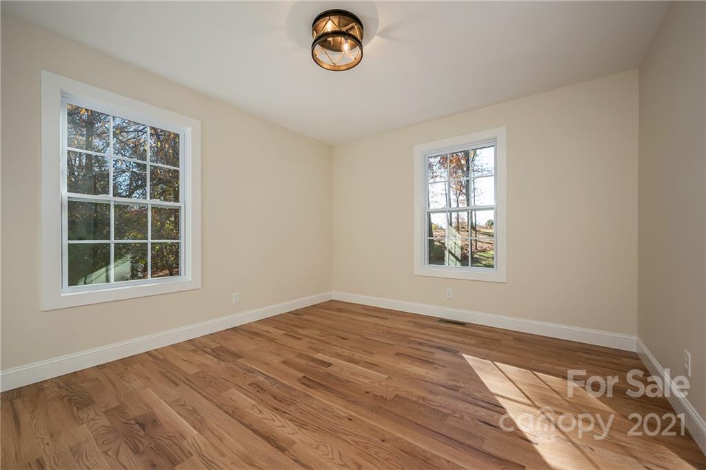438 Gilbert Road Columbus, NC 28722 - Photo 22 of 46 an empty room with a window