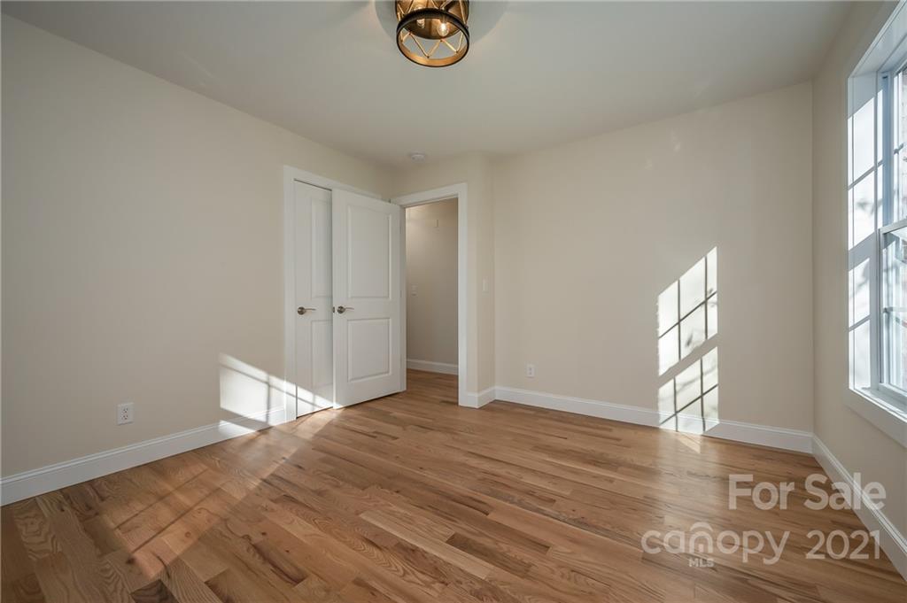 438 Gilbert Road Columbus, NC 28722 - Photo 23 of 46 an empty room with windows and closet