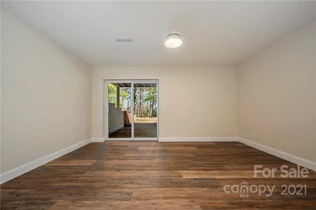 438 Gilbert Road Columbus, NC 28722 - Photo 27 of 46 a view of an empty room with a window