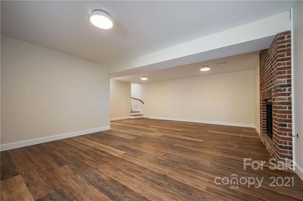 438 Gilbert Road Columbus, NC 28722 - Photo 28 of 46 a view of empty room with wooden floor