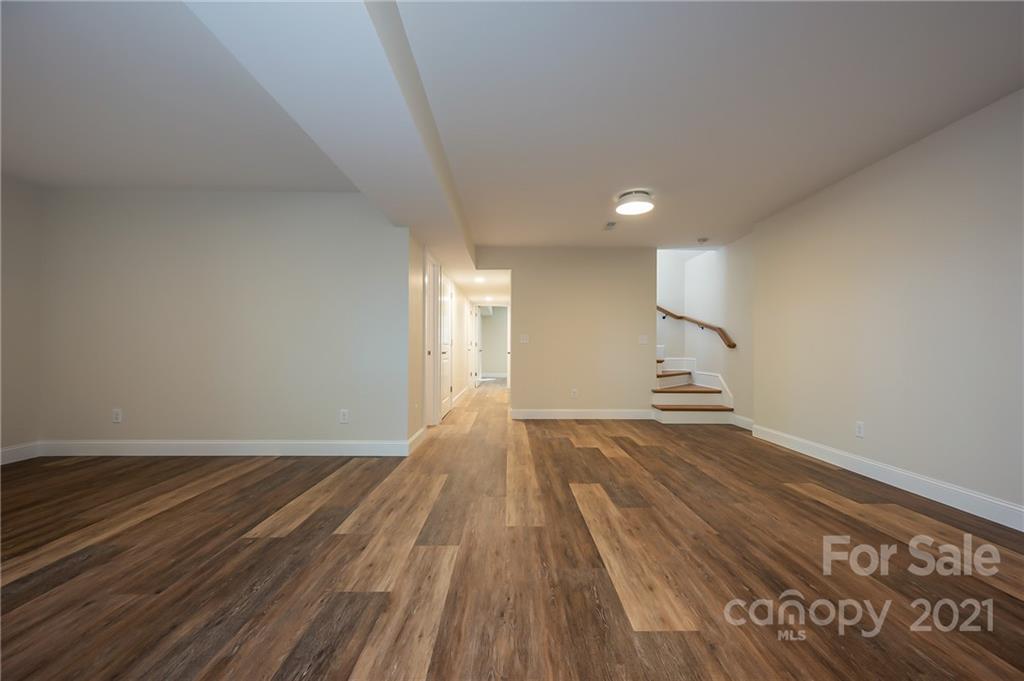 438 Gilbert Road Columbus, NC 28722 - Photo 29 of 46 a view of empty room with wooden floor