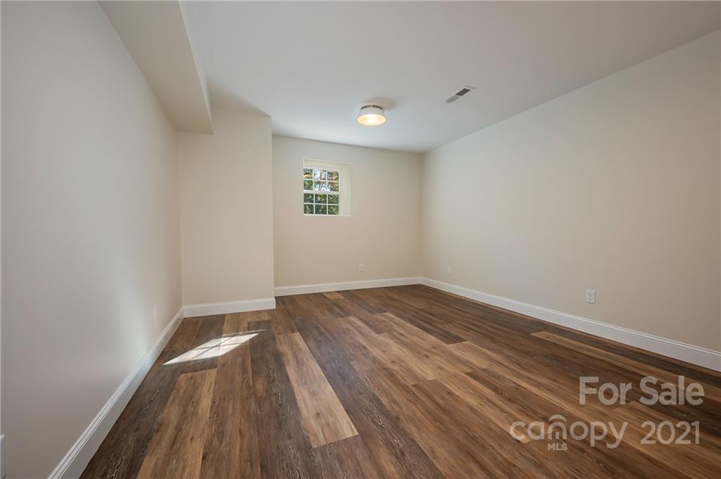 438 Gilbert Road Columbus, NC 28722 - Photo 33 of 46 a view of empty room with wooden floor