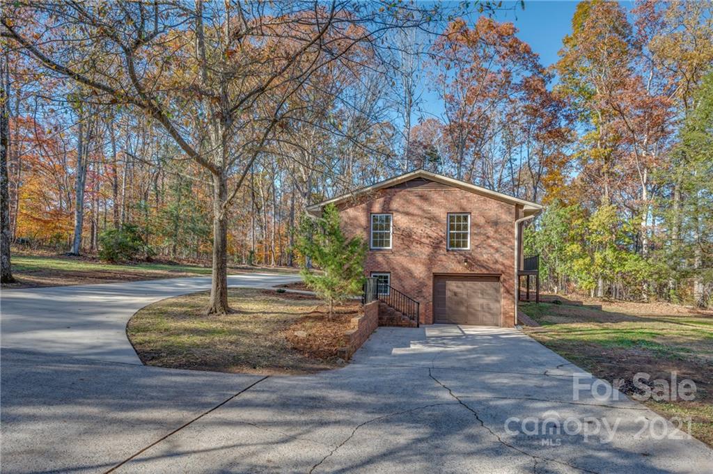 438 Gilbert Road Columbus, NC 28722 - Photo 39 of 46 a tree in the middle of a yard