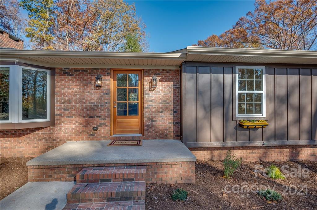 438 Gilbert Road Columbus, NC 28722 - Photo 46 of 46 a front view of a house with garden