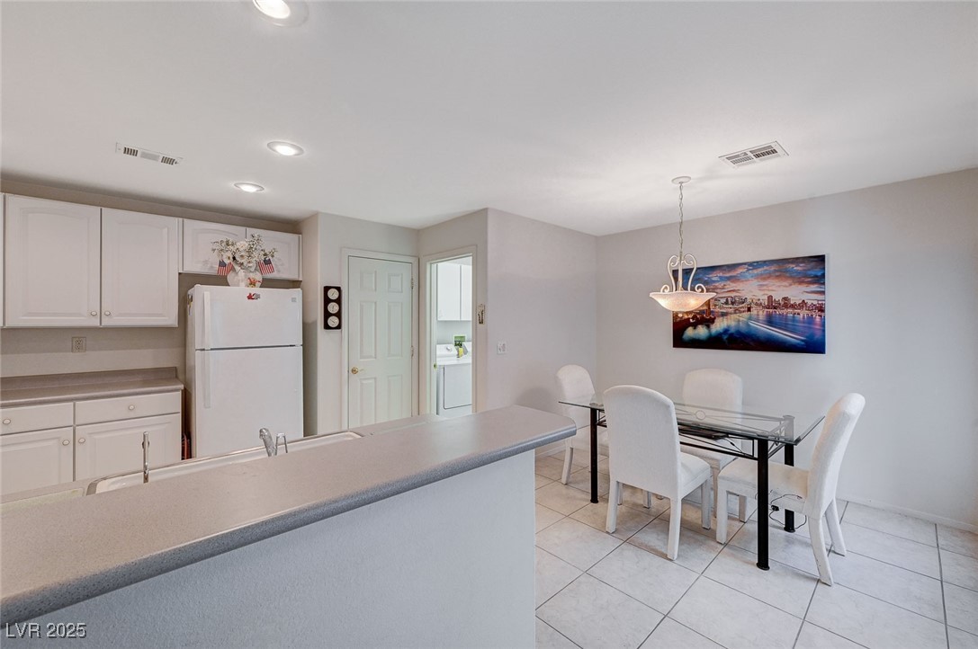 516 Crimson View Place Las Vegas, NV 89144 - Photo 17 of 66 Dining area with light tile patterned floors, recessed lighting, and washer / clothes dryer