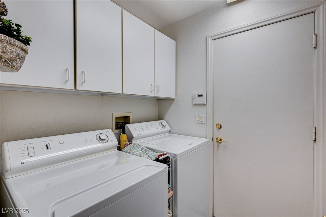 516 Crimson View Place Las Vegas, NV 89144 - Photo 25 of 66 Laundry area featuring cabinet space and separate washer and dryer